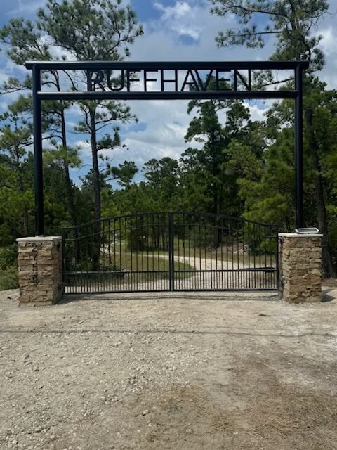 Custom property entry gate and entrance project with stonework by Rockin' D Services in Huntsville TX