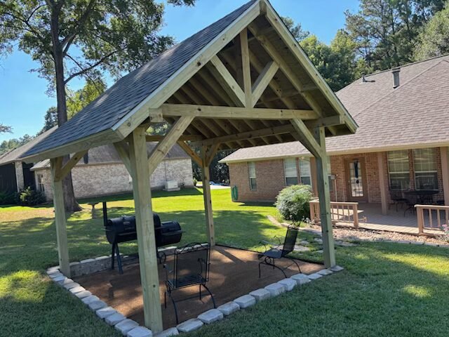 Custom timber pavilion and outdoor living area built by Rockin' D Services in Huntsville TX