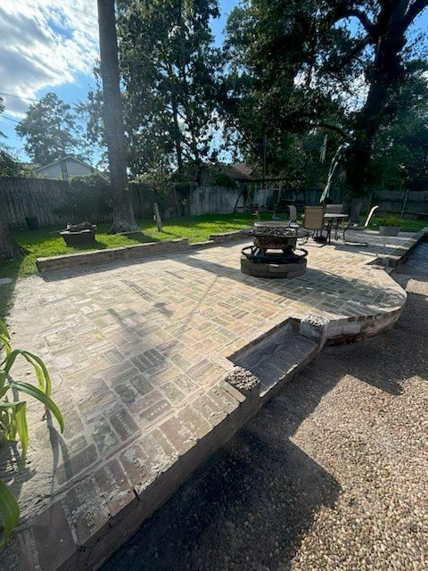 Custom concrete and brick patio installed by Rockin' D Services in Huntsville TX