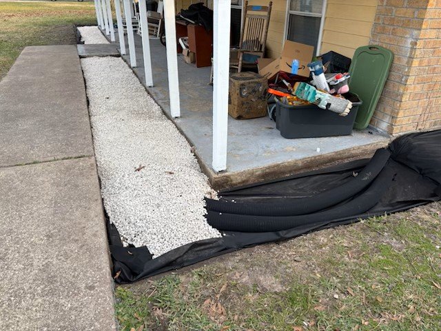 French drain installation with gravel and drainage fabric by Rockin' D Services in Huntsville TX