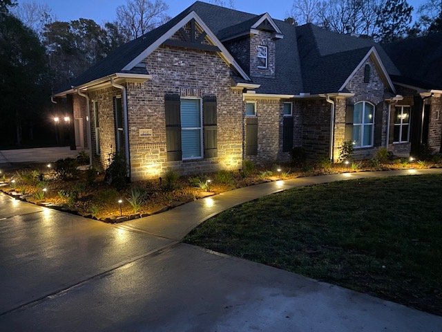 Landscape lighting and professional landscaping project by Rockin' D Services in Huntsville TX