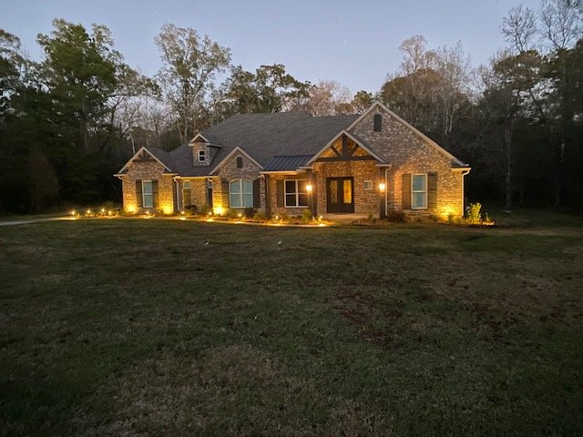 Professional landscape lighting and outdoor landscaping by Rockin' D Services in Huntsville TX