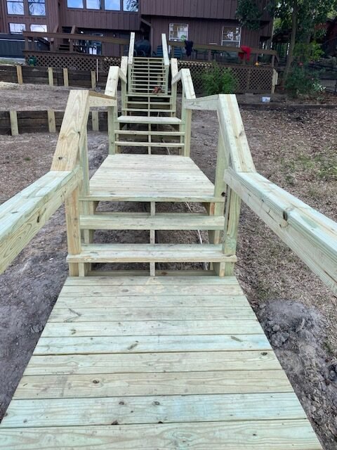 Custom wood stairs and elevated walkway built by Rockin' D Services in Huntsville TX