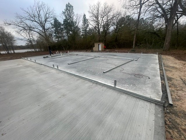 Concrete shop pad installation by Rockin' D Services in Huntsville TX