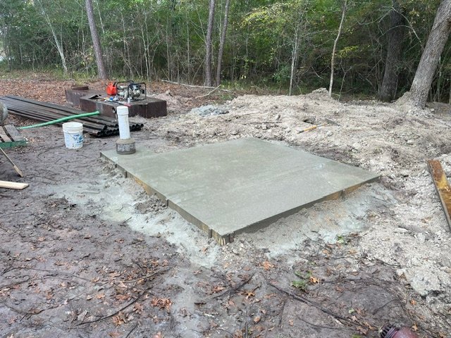 Concrete well house pad installed by Rockin' D Services in Huntsville TX